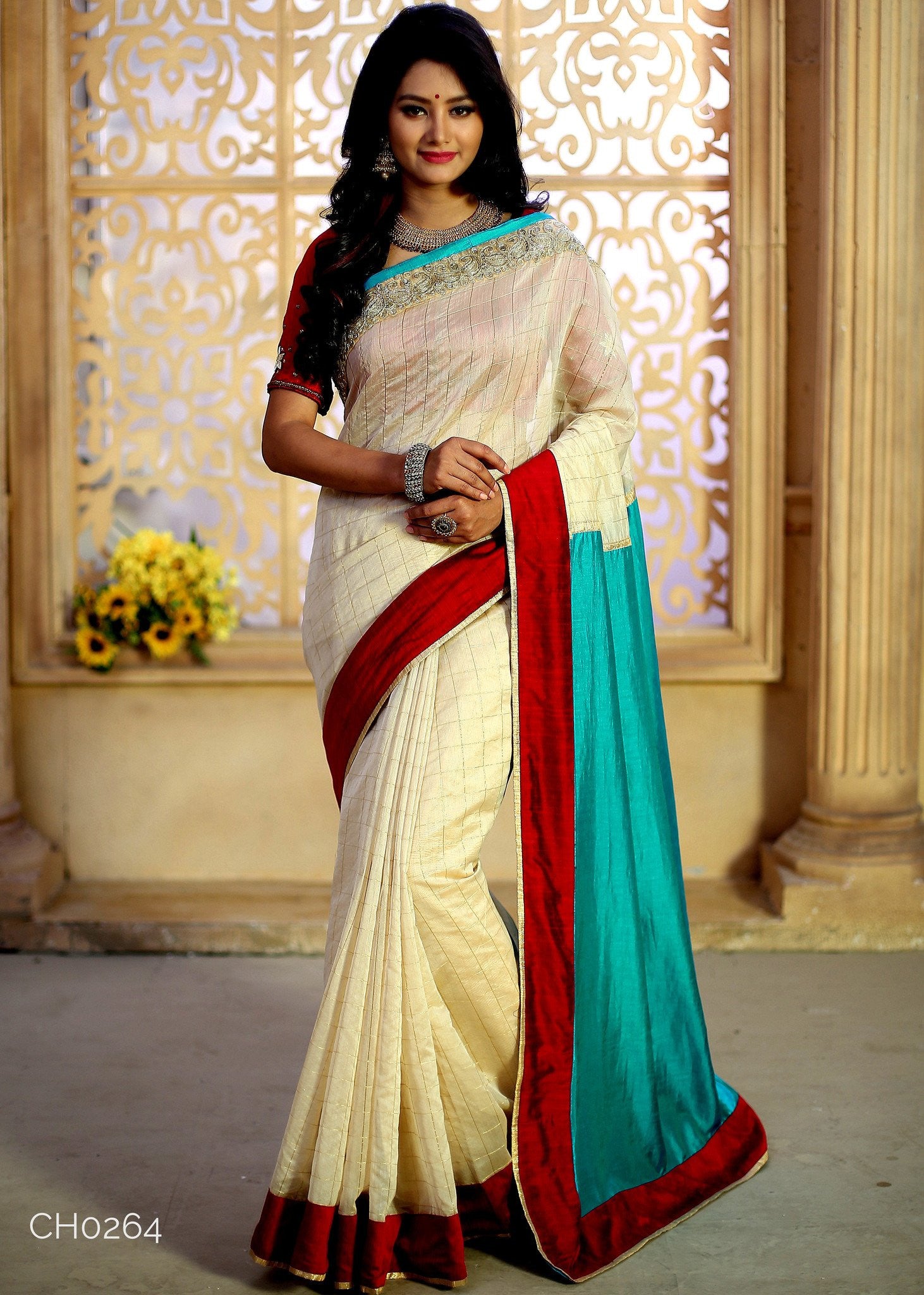 Beige chanderi with golden checks combined with green barfi silk & zari work border